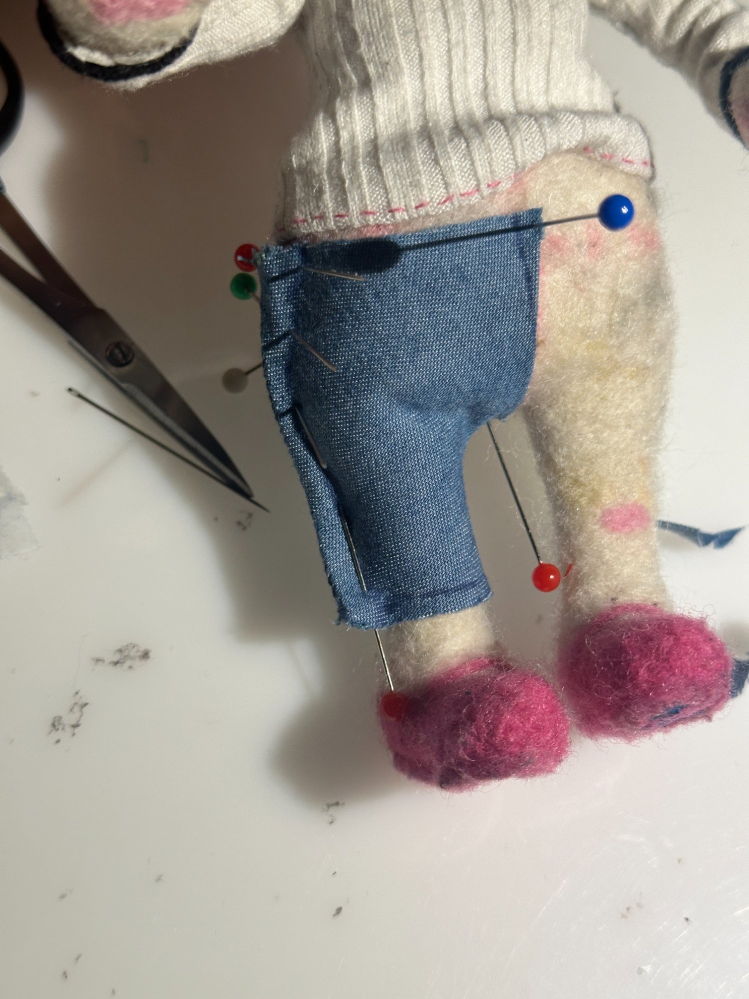 Jeans back detail with pink stitching