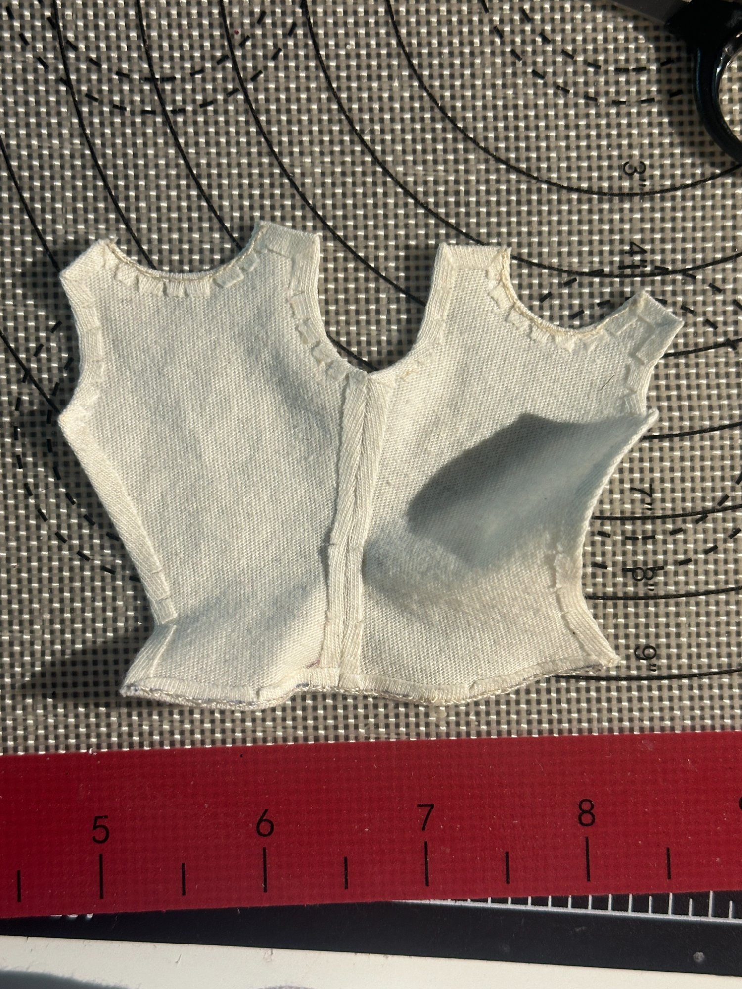 Finished shirt on green maquette, front